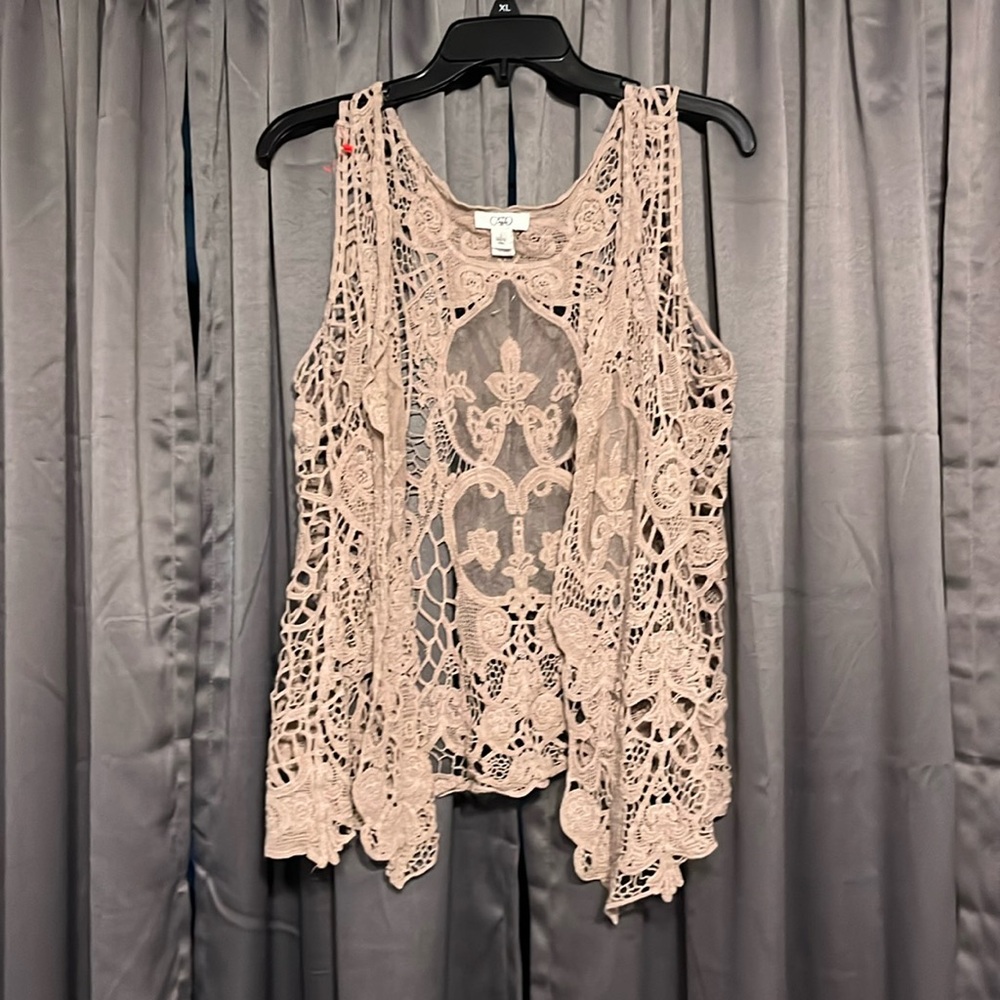 You wear it over a tank top or a blouse